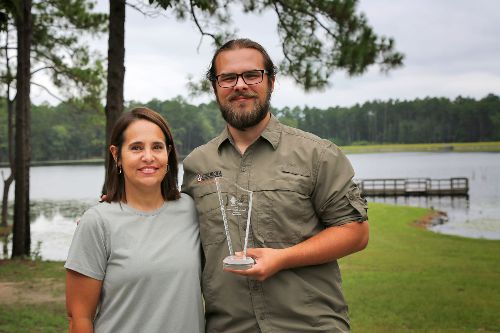 Caleb Mills and Casey Corbett with OTC Alumni Award