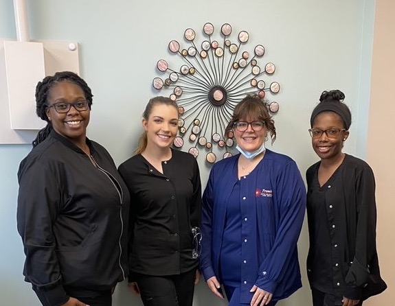 OTC Dental Assissting students posing together at Gift of Dentistry