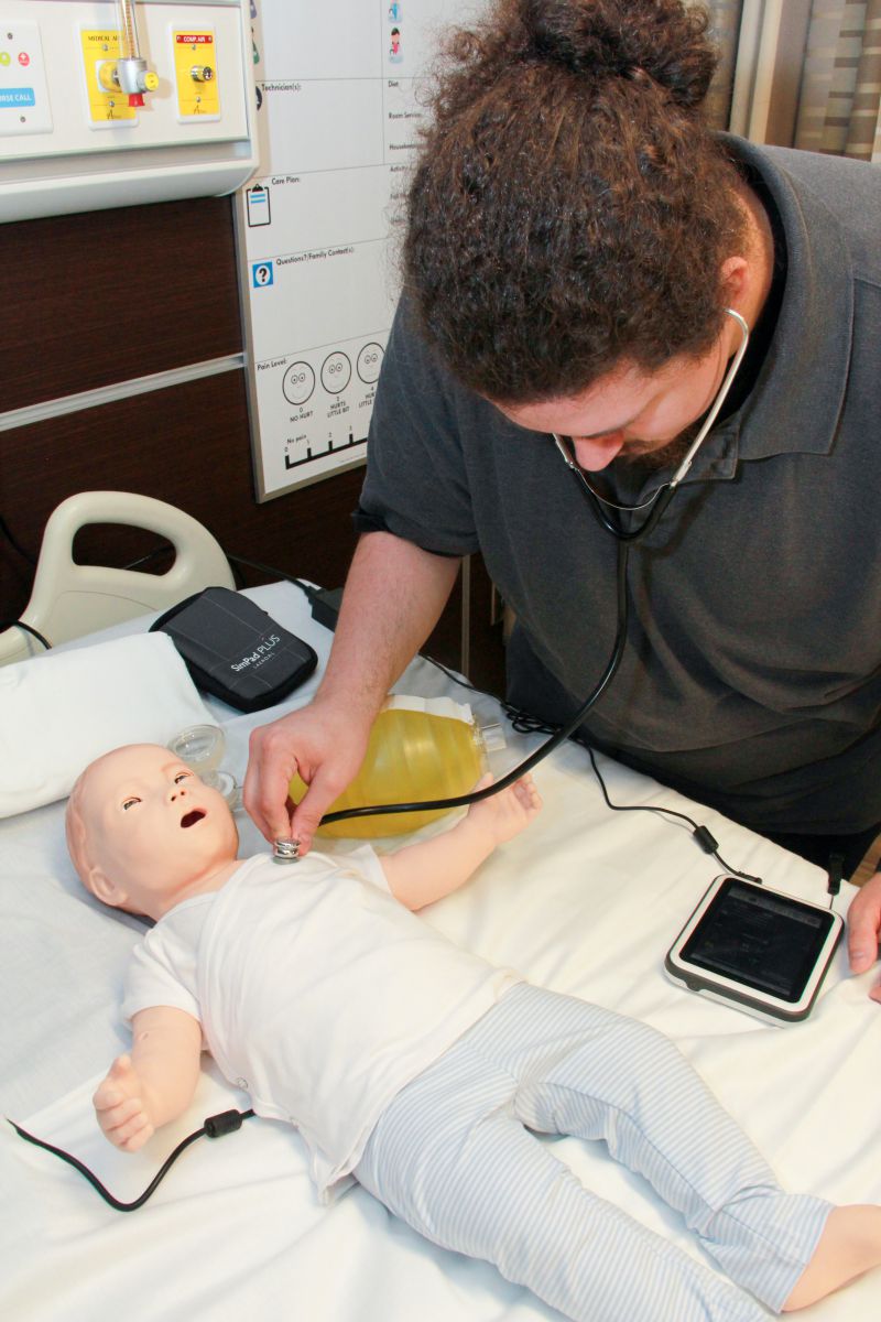 OTC nursing student with SimBaby, a tetherless pediatric simulator.