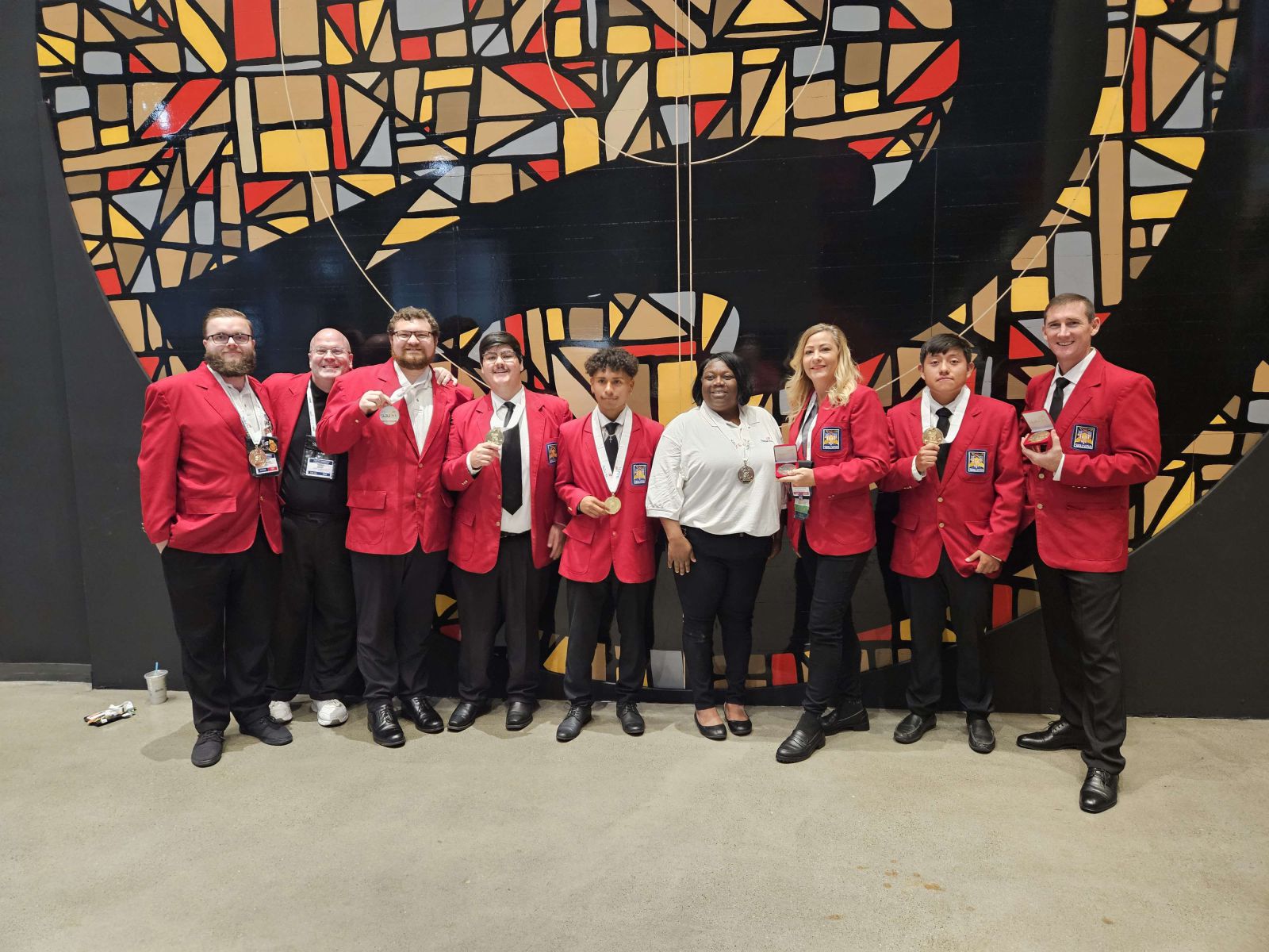 Ogeechee Tech students and medal winners posing together in a group photo at SkillsUSA 