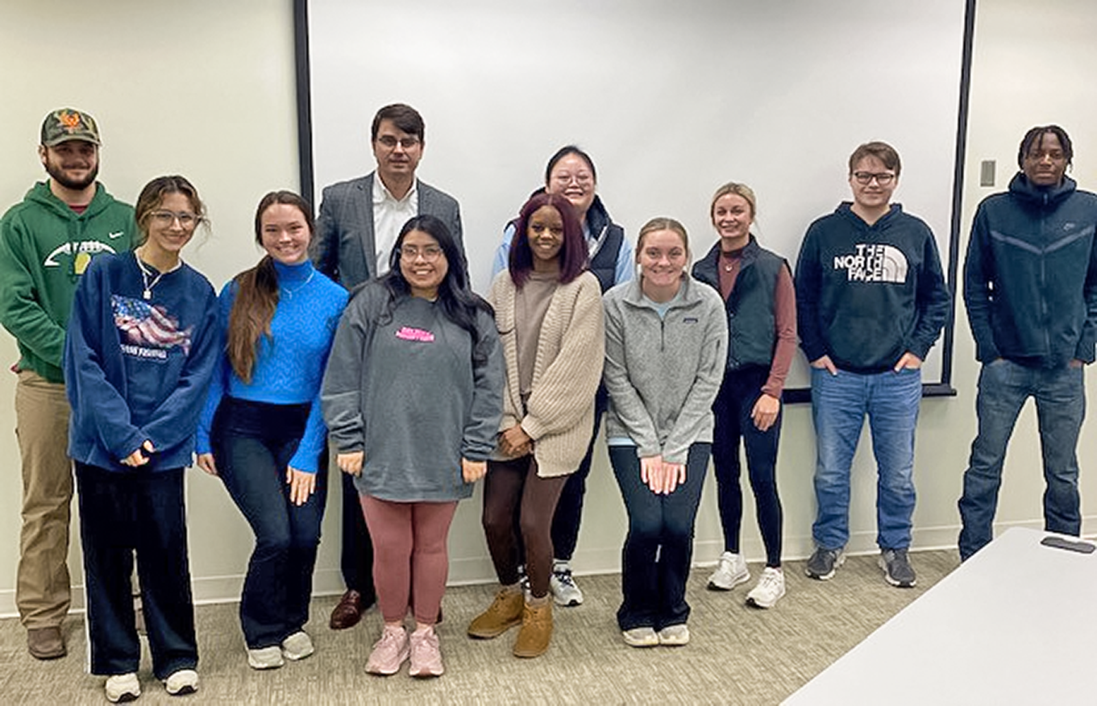 Tal Johnson, a CPA with Dabbs, Hickman, Hill, & Cannon, LLP, with OTC's Business Management program students during class.