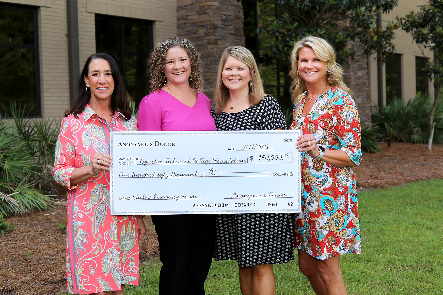 Michelle Davis, Christy Rikard, Christina Harrell, and President Lori Durden with donation check.