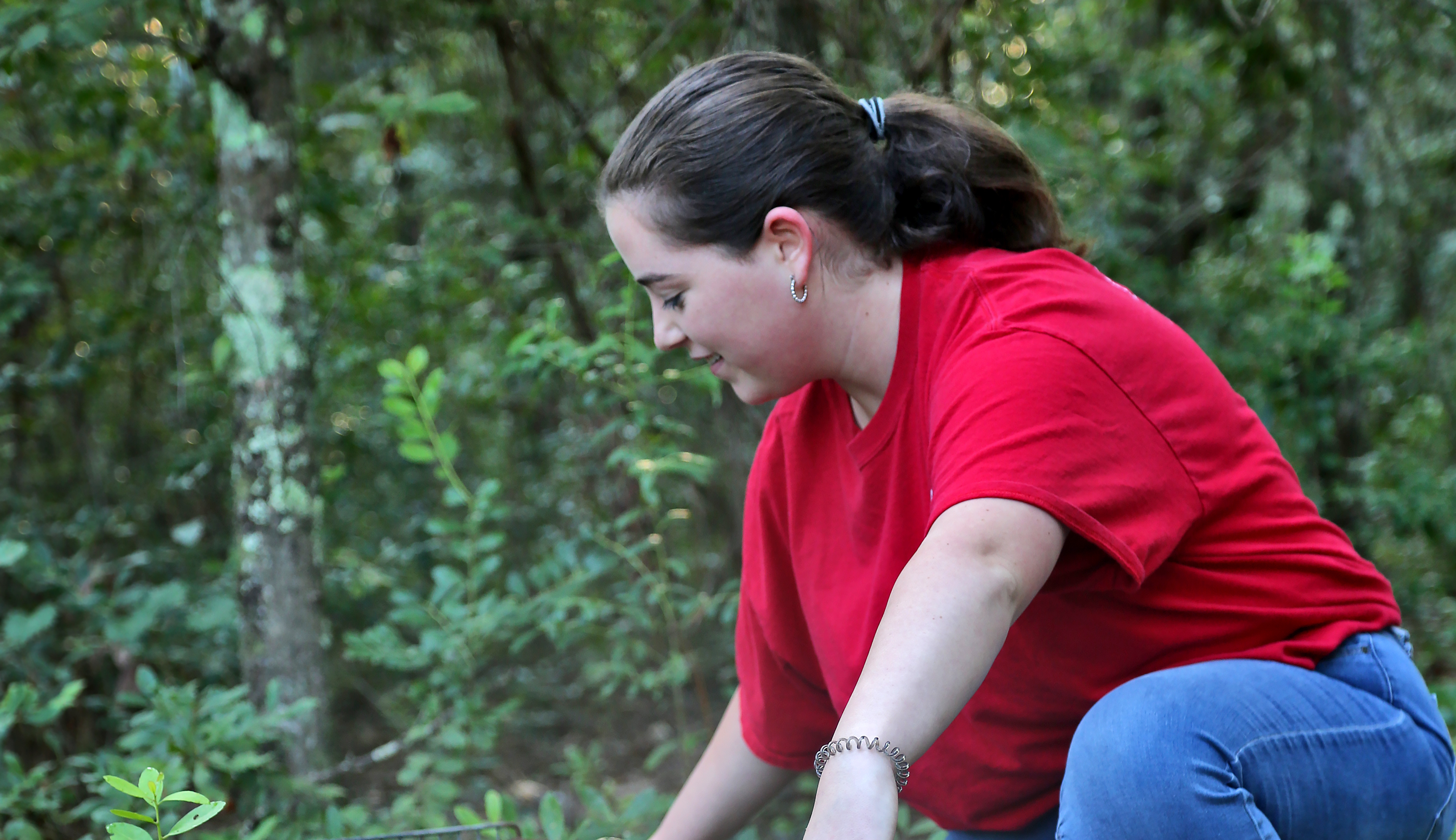 OTC Fish and Wildlife student releasing a possum in class.