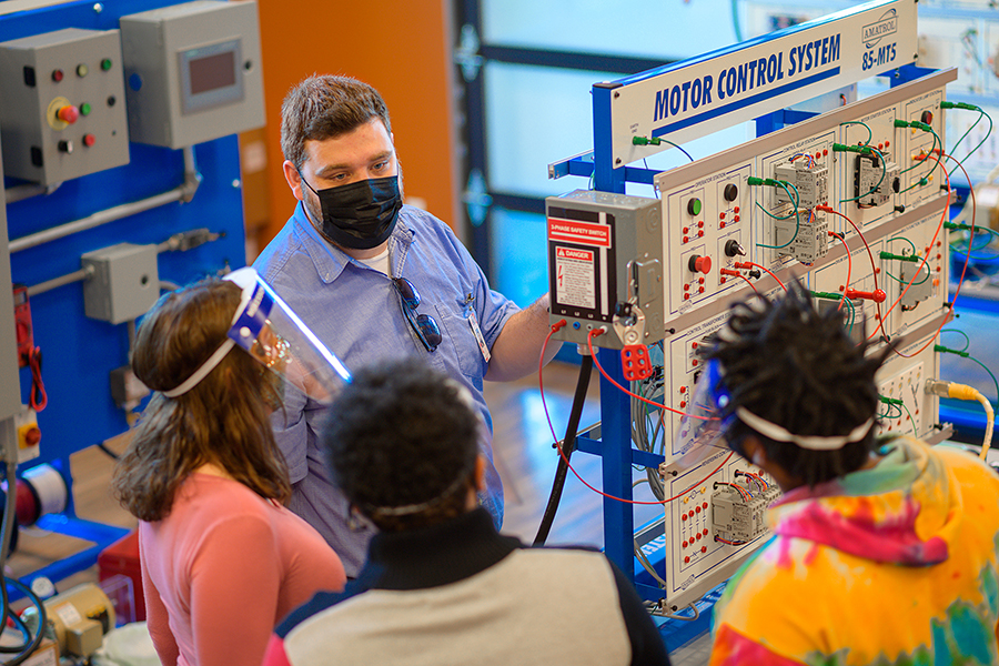 Instructor and Students Learning on Amatrol Equipment